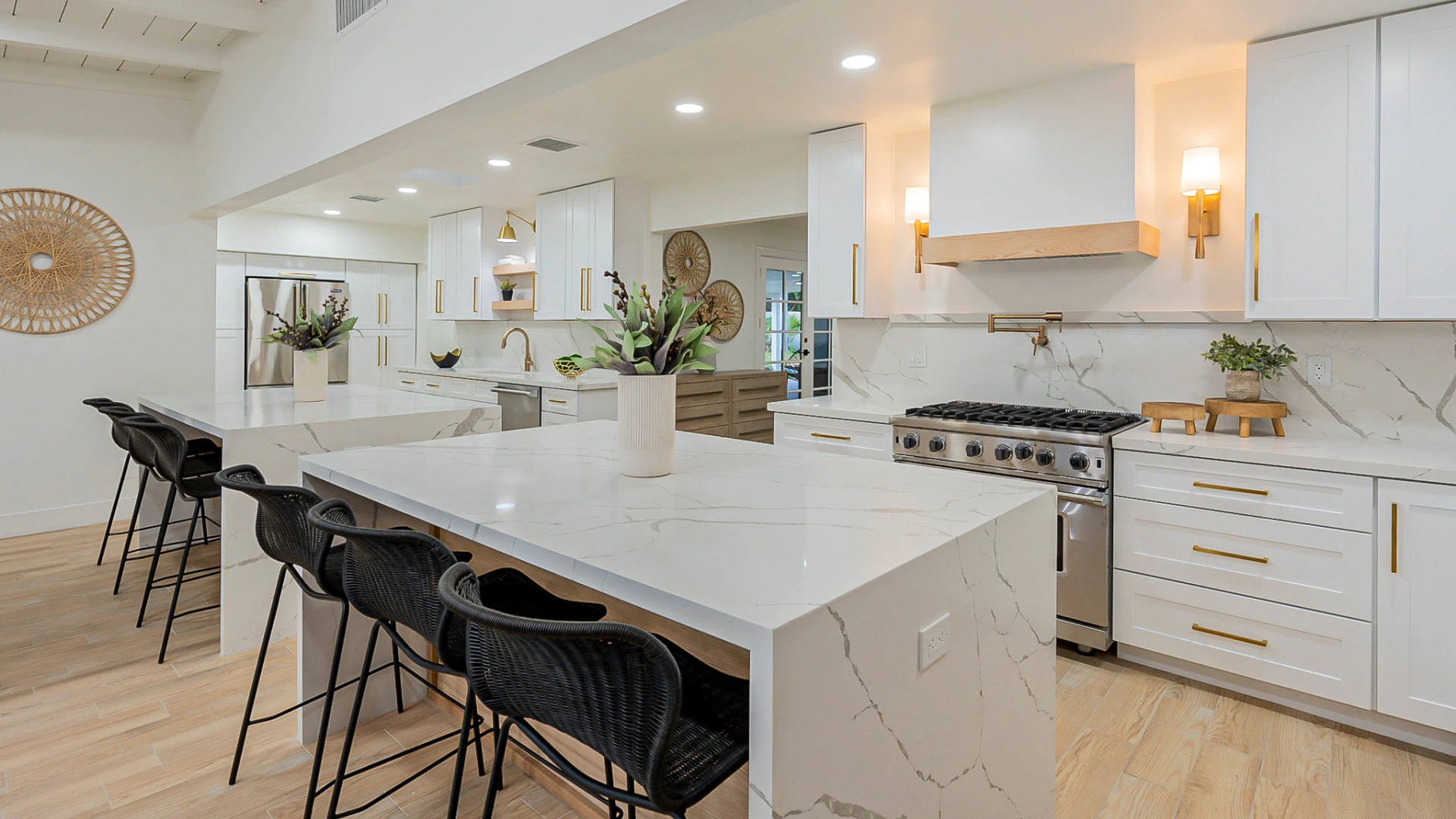 luxurious residential house kitchen with bright lighting and clean white cabinets and countertop